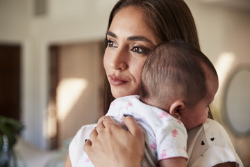 Mom and baby dark hair at home lips